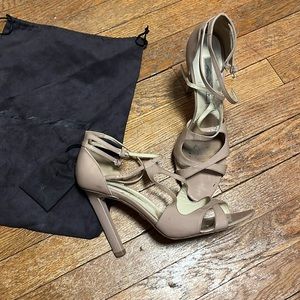 Brian Atwood patent leather heel sandals with ankle strap.